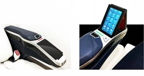 Seat armrest with hidden touchscreen
